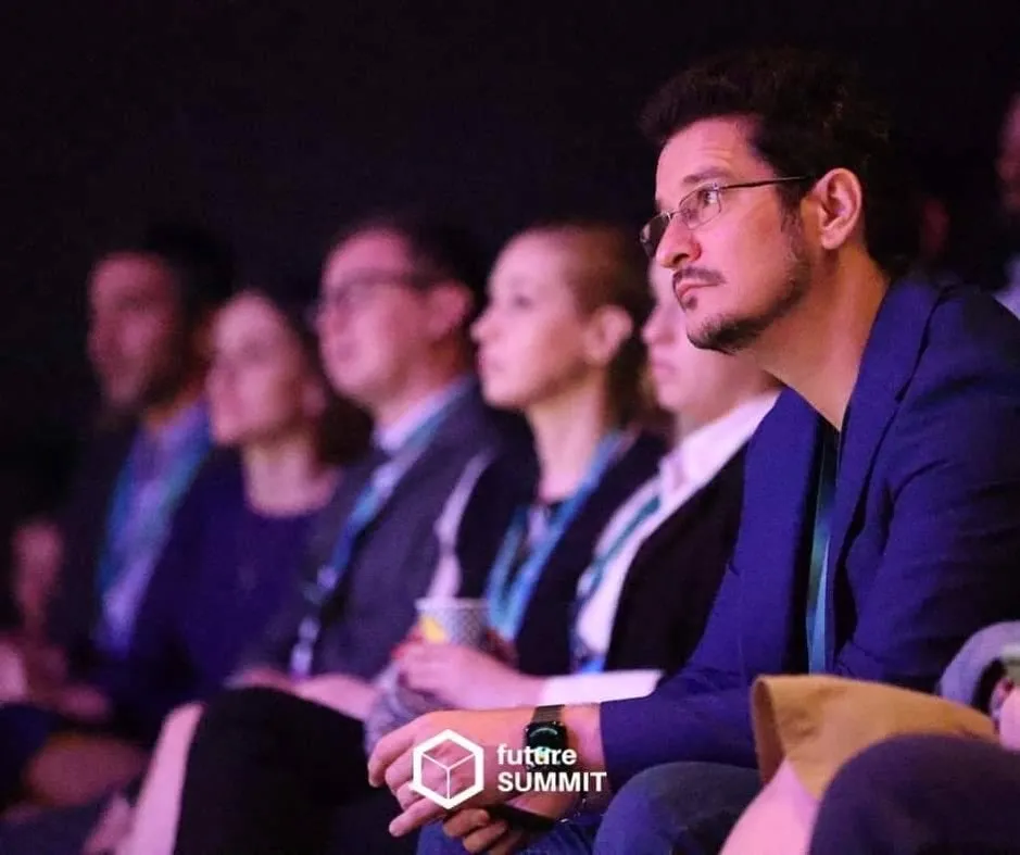 Sebastian Cochinescu listens attentively while seated in the audience at Future Summit.