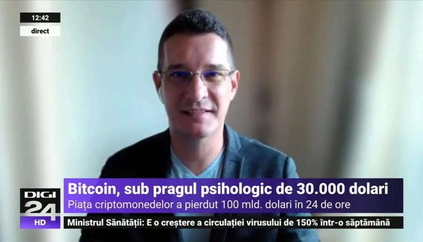 Sebastian Cochinescu discusses Bitcoin during a remote interview broadcast on Digi24.