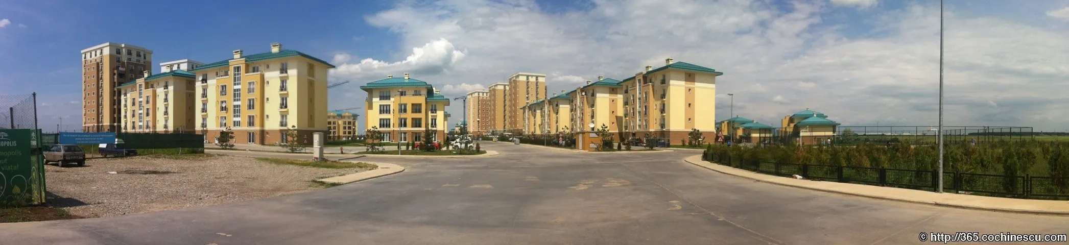 A panorama captures the apartment buildings and streets of the Cosmopolis residential complex.