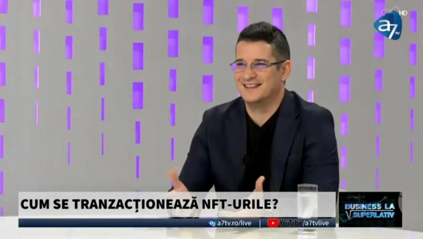 Sebastian Cochinescu smiles during an A7TV discussion about trading NFTs.