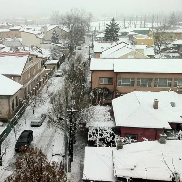 Snow-covered residential street in Bucharest, seen from an upper floor