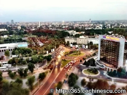 Bucharest seen from above, with University Square and the InterContinental Hotel in the foreground.