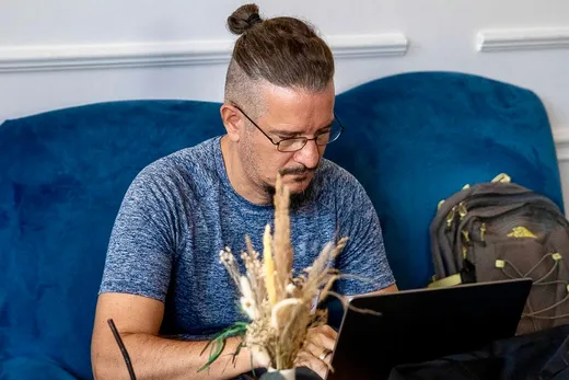 Sebastian Cochinescu working on a laptop